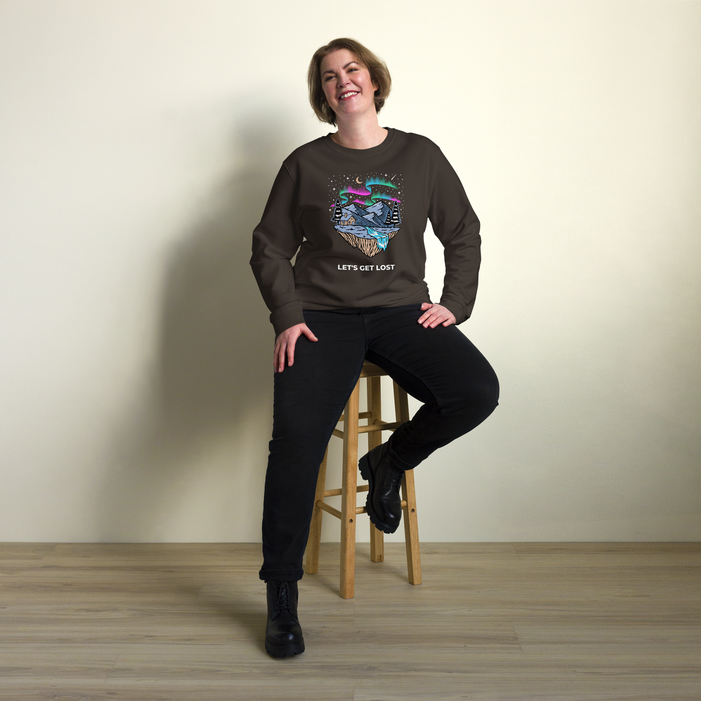 Smiling woman wearing a Deep Charcoal Grey Let's Get Lost Organic Cotton Sweatshirt - Boozy Fox