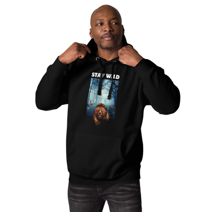 Man wearing a Black Premium Bear Hoodie featuring a Stay Wild graphic on the chest - Cool Graphic Bear Hoodies - Boozy Fox
