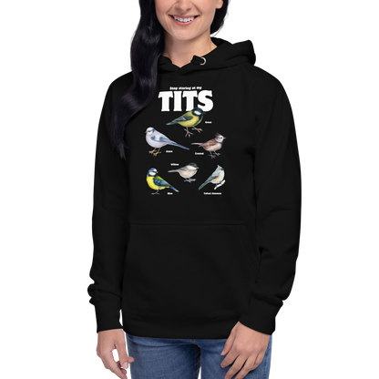 Woman wearing a Funny Stop Staring At My Tits Bird premium graphic hoodie in black by Boozy Fox