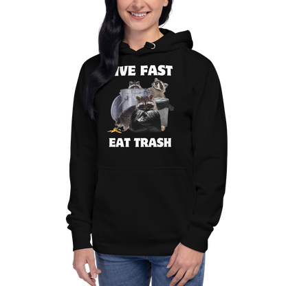 Woman wearing a funny Live Fast Eat Trash Raccoon premium graphic hoodie in black by Boozy Fox