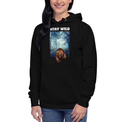 Woman wearing a Funny Stay Wild Bear premium graphic hoodie in black by Boozy Fox