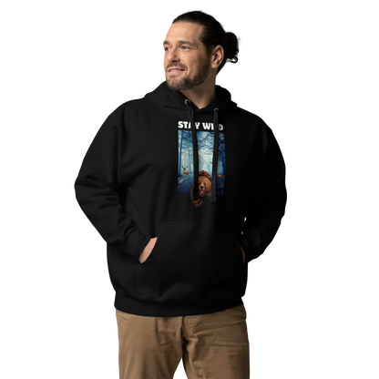 Man wearing a Funny Stay Wild Bear premium graphic hoodie in black by Boozy Fox