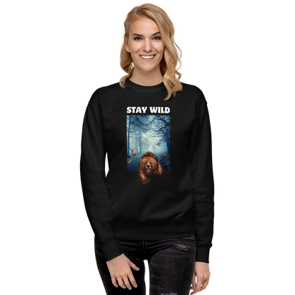 Smiling woman wearing a Black Stay Wild Bear Graphic Premium Sweatshirt - Boozy Fox