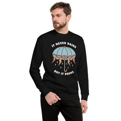 Man wearing a Black It Never Rains But It Pours Graphic Premium Sweatshirt - Boozy Fox
