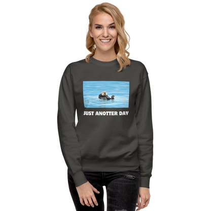 Smiling woman wearing a Vintage Black Just Anotter Day Otter Graphic Premium Sweatshirt - Boozy Fox
