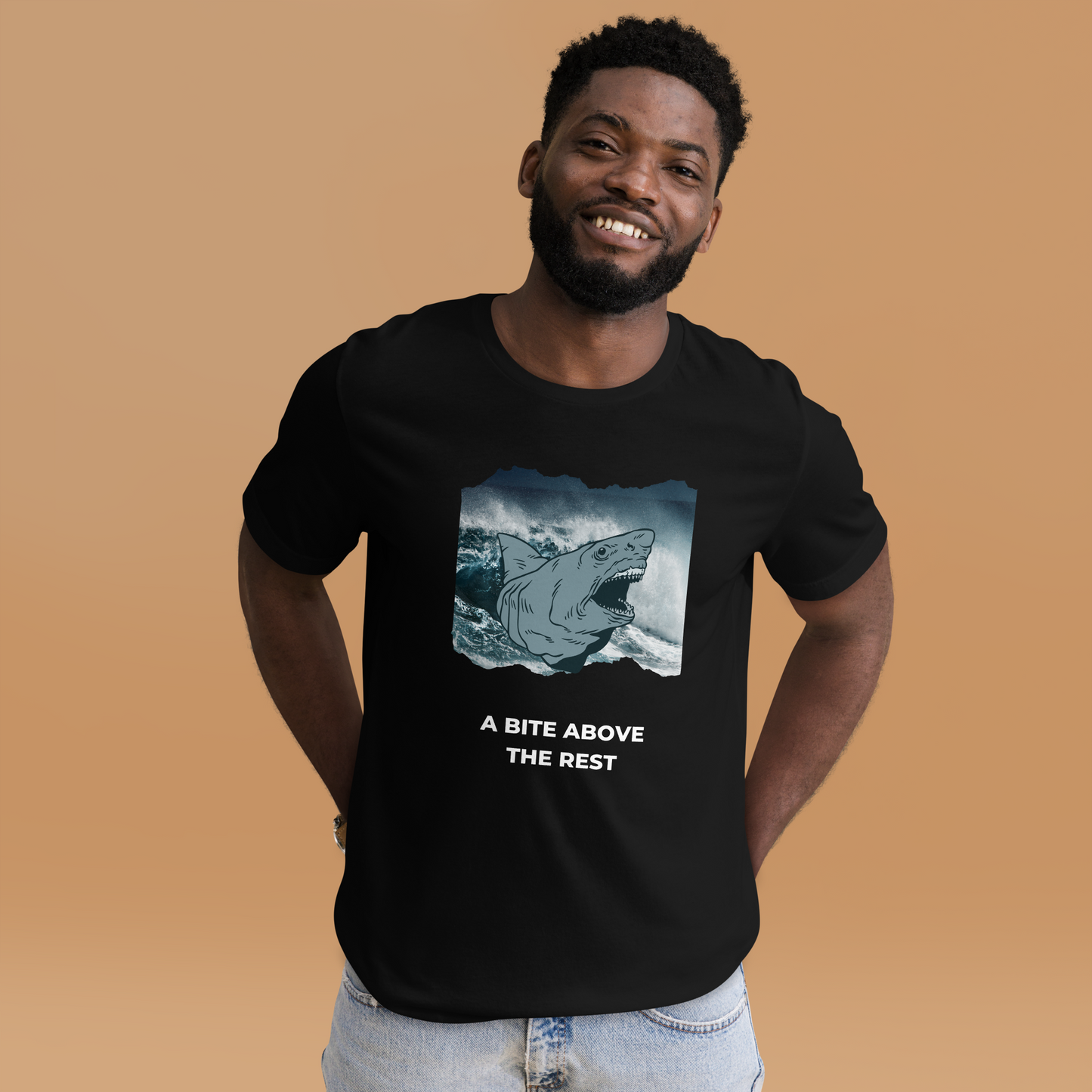 Smiling man wearing a Black Premium Megalodon Tee featuring A Bite Above the Rest graphic on the chest - Funny Graphic Megalodon Tees - Boozy Fox