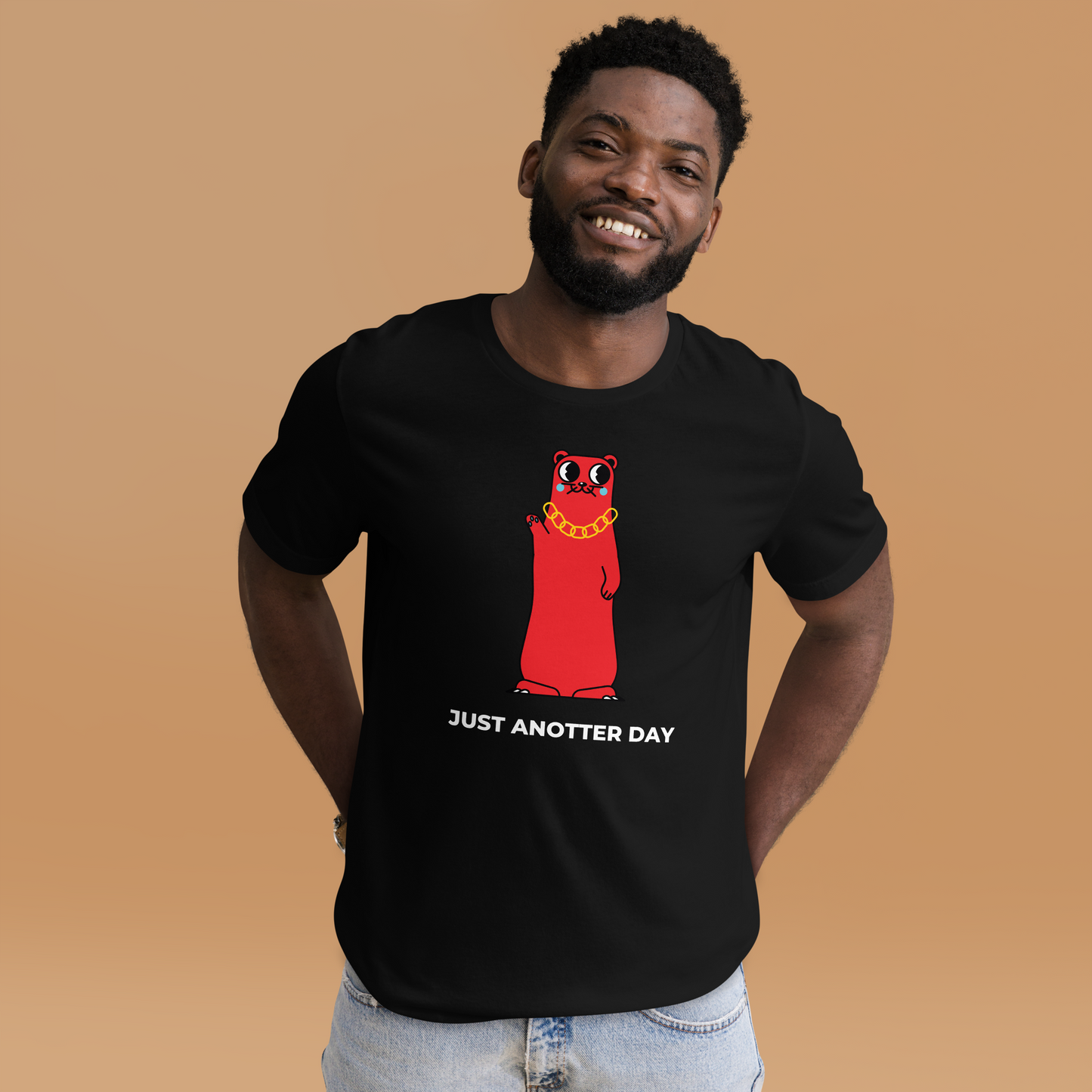 Smiling man wearing a Black Premium Otter T-Shirt featuring a Just Anotter Day graphic on the chest - Funny Graphic Otter Tees - Boozy Fox