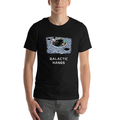 Man wearing a Black Premium Galactic Hangs Tee featuring an out-of-this-world graphic of an Astronaut and Alien Chilling Together - Funny Graphic Space Tees - Boozy Fox