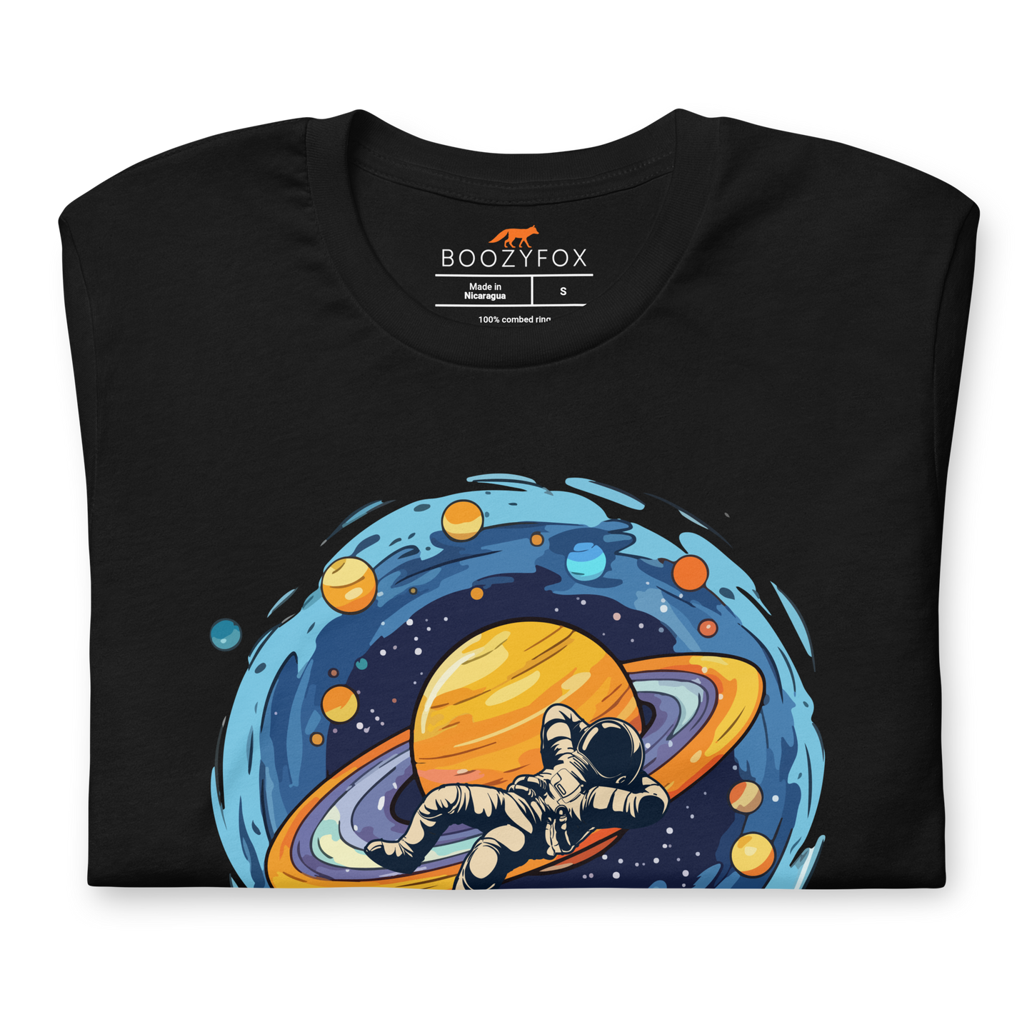 Front details of a Black Premium Astronaut Tee featuring a captivating I Need More Space graphic on the chest - Funny Graphic Space Tees - Boozy Fox