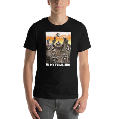 Man wearing a Funny In My Feral Era Raccoon lightweight graphic t-shirt in black by Boozy Fox