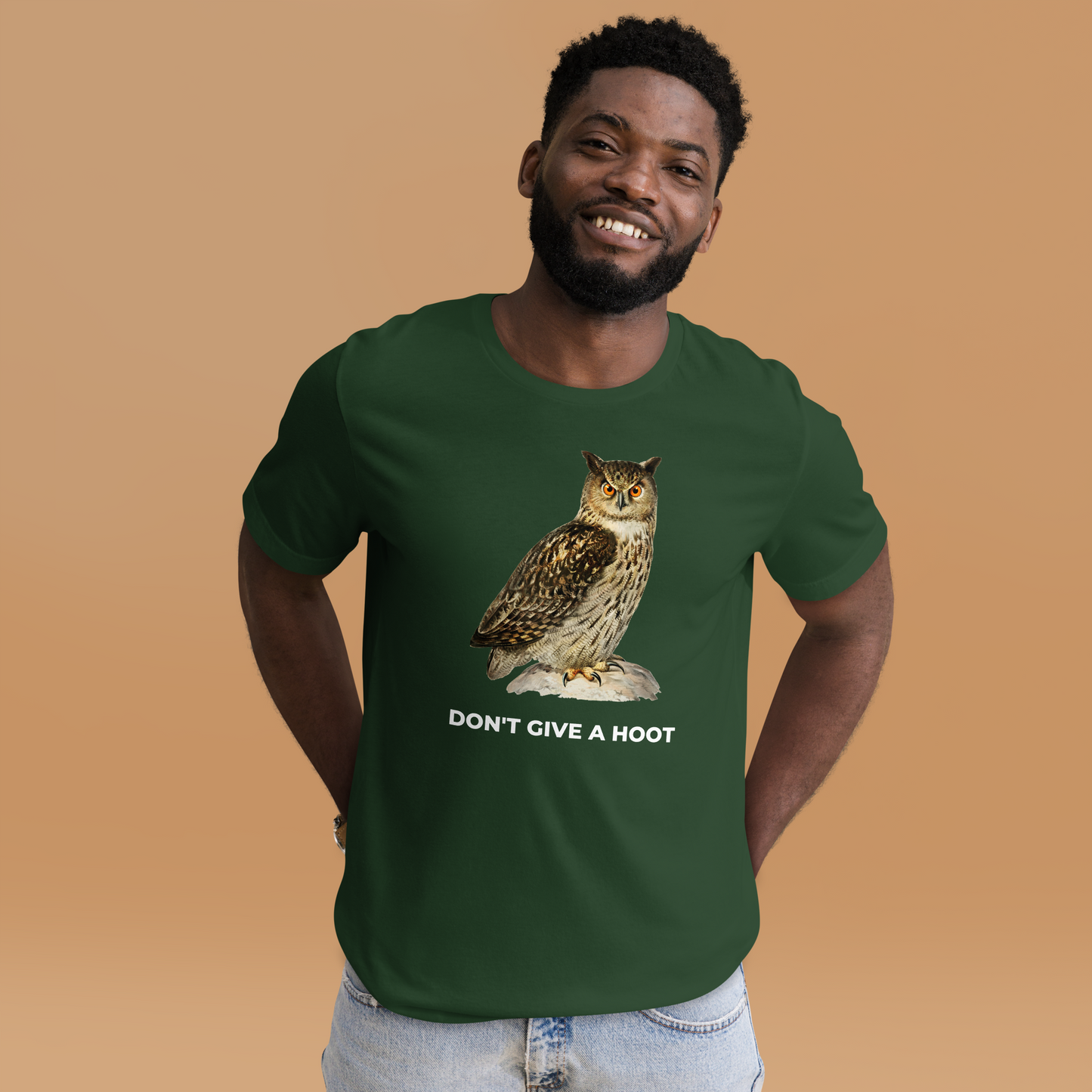 Smiling man wearing a Forest Green Premium Owl T-Shirt featuring a captivating Don't Give A Hoot graphic on the chest - Funny Graphic Owl Tees - Boozy Fox