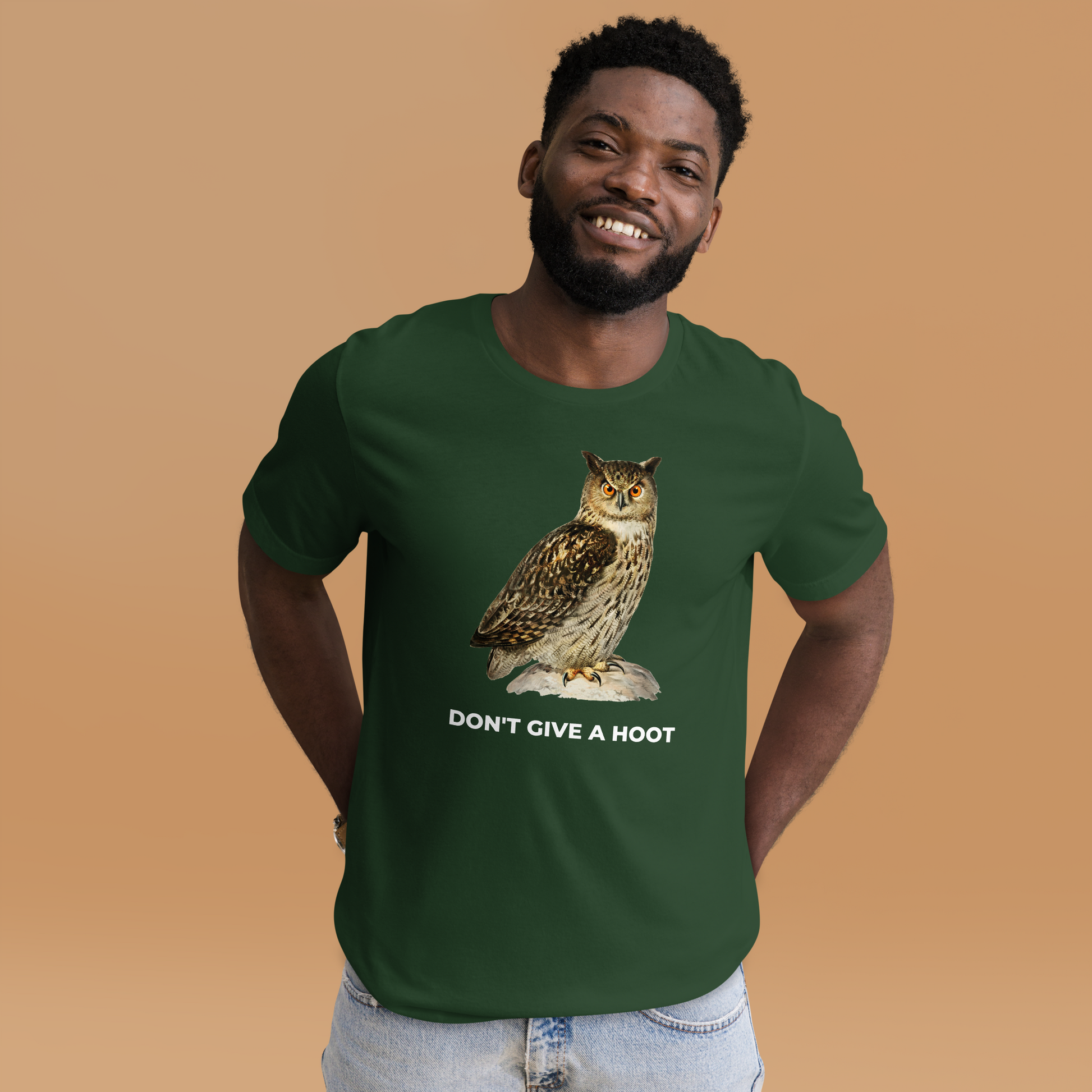 Smiling man wearing a Forest Green Premium Owl T-Shirt featuring a captivating Don't Give A Hoot graphic on the chest - Funny Graphic Owl Tees - Boozy Fox