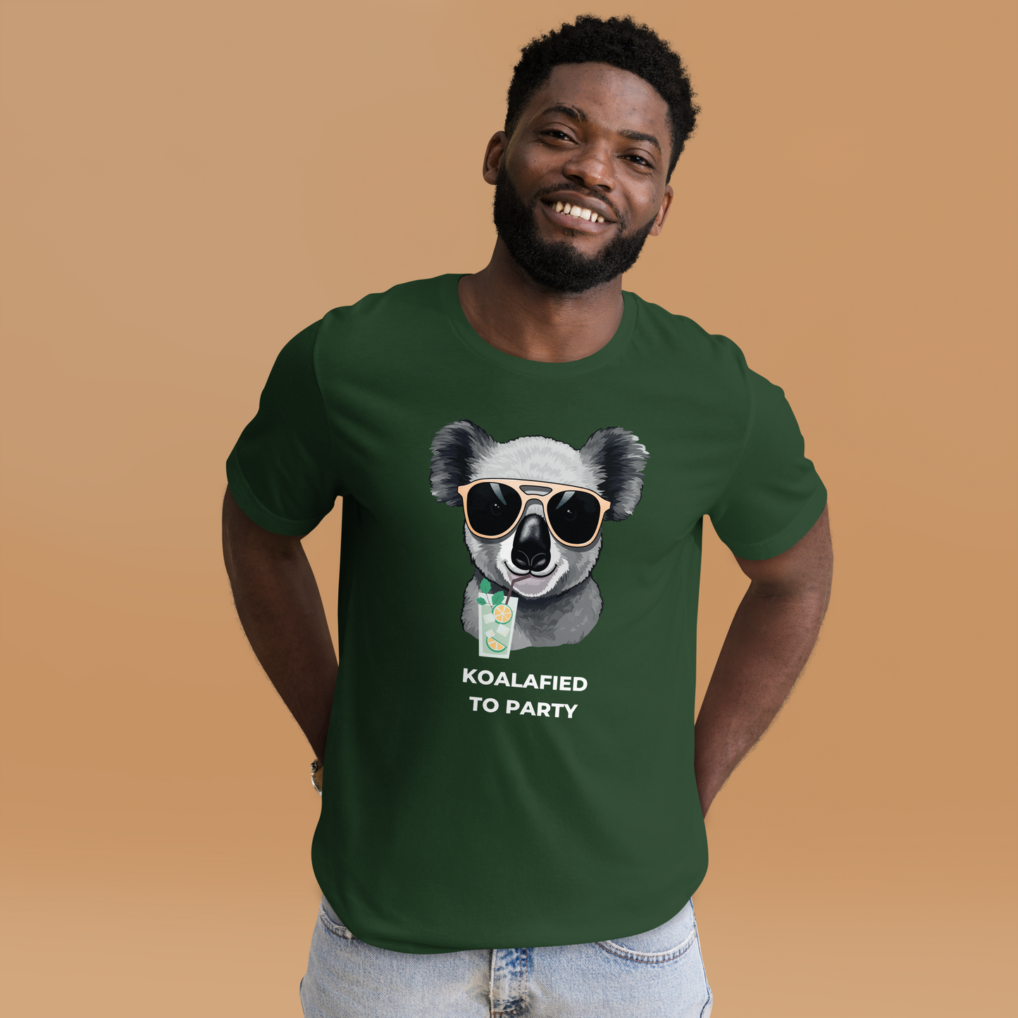 Smiling man wearing a Forest Green Premium Koala Tee featuring an adorable Koalafied To Party graphic on the chest - Funny Graphic Koala Tees - Boozy Fox