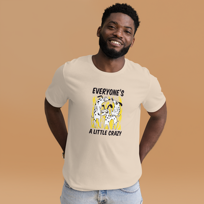 Smiling man wearing a Soft Cream Premium Dog T-Shirt featuring a Everyone's A Little Crazy graphic on the chest - Funny Graphic Dog Tees - Boozy Fox
