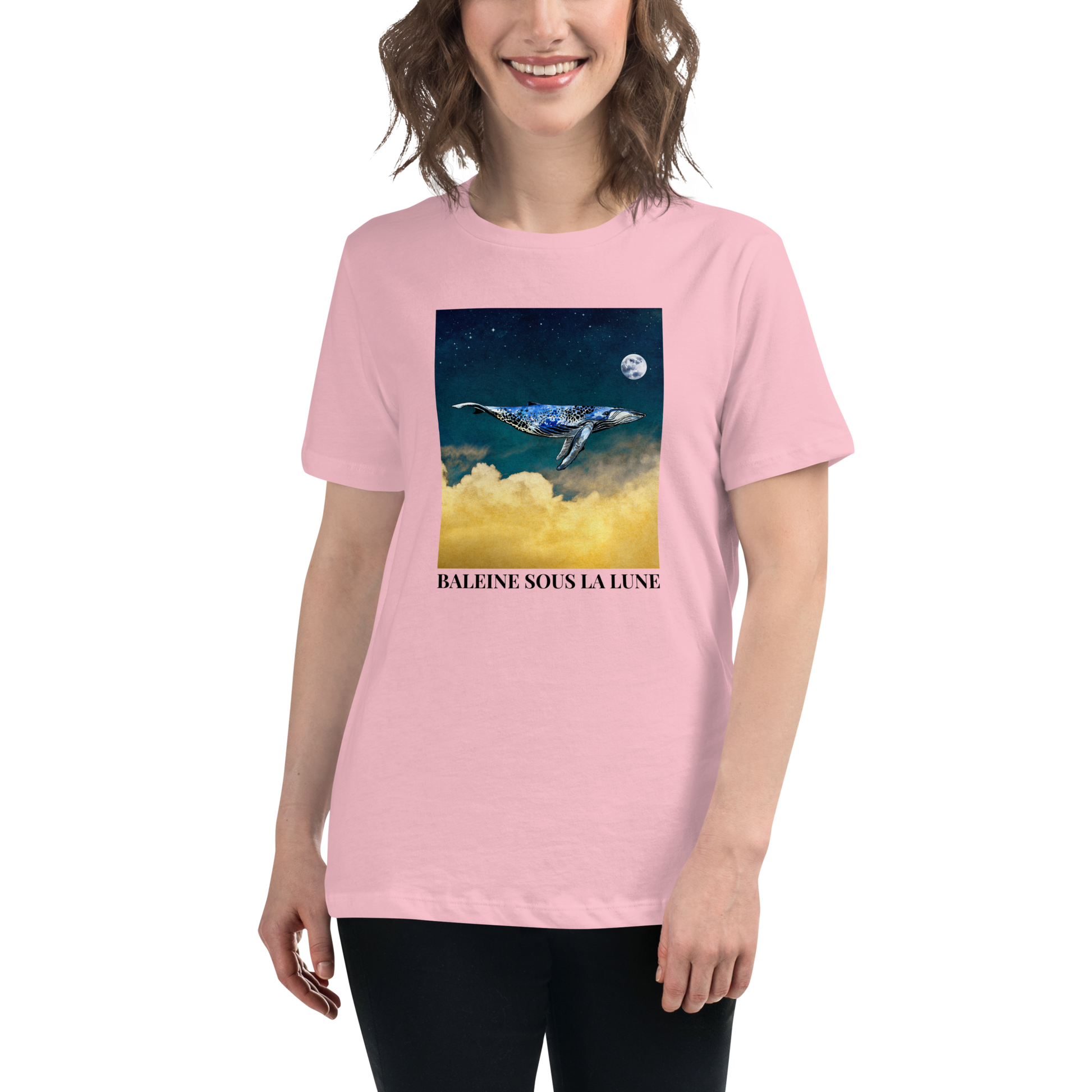 Smiling Woman Wearing a Women's relaxed pink whale t-shirt featuring a majestic Whale Under The Moon graphic on the chest - Women's Graphic Whale Tees - Boozy Fox