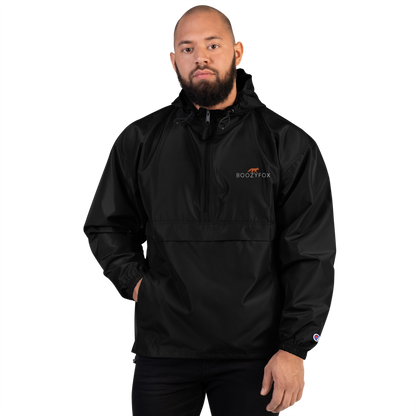 Man Wearing a Black Champion Packable Jacket featuring a sleek embroidered Boozy Fox logo on the chest - Waterproof Champion Windbreakers & Raincoats - Boozy Fox
