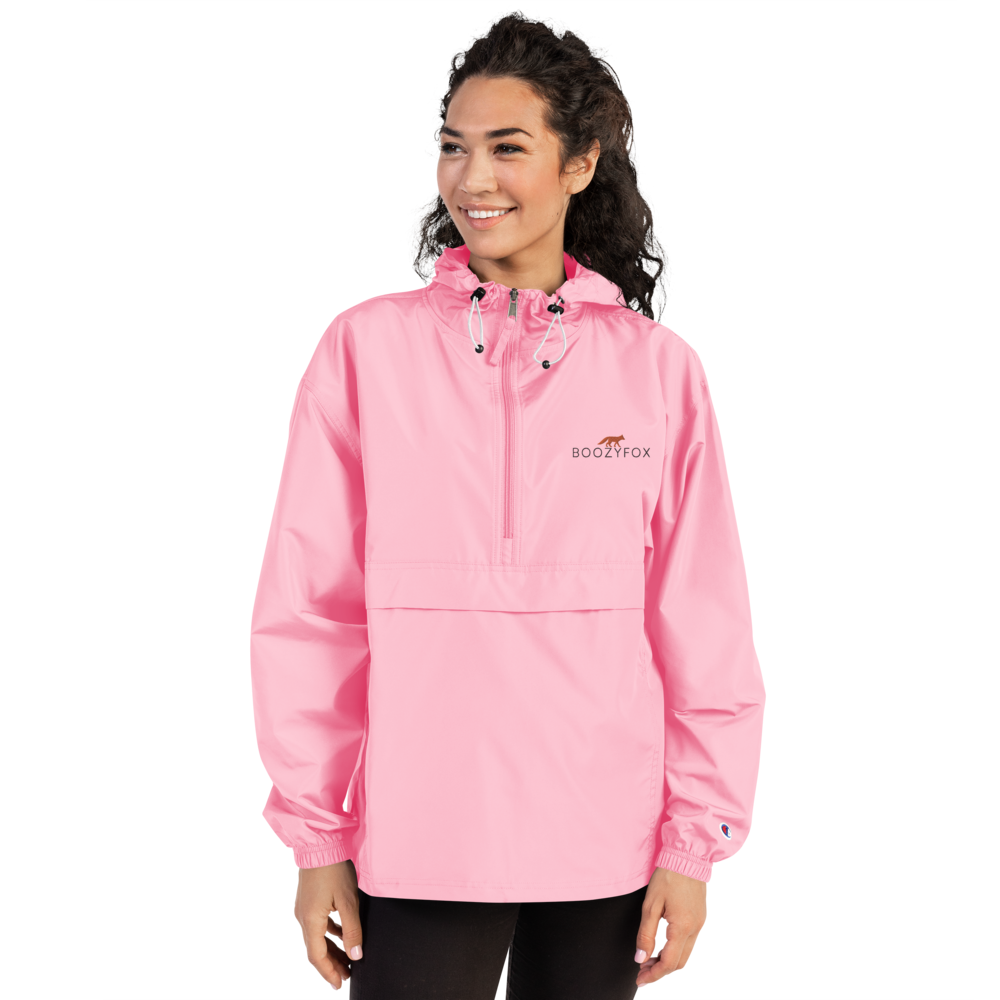 Smiling Woman Wearing a Pink Champion Packable Jacket featuring a sleek embroidered Boozy Fox logo on the chest - Waterproof Champion Windbreakers & Raincoats - Boozy Fox