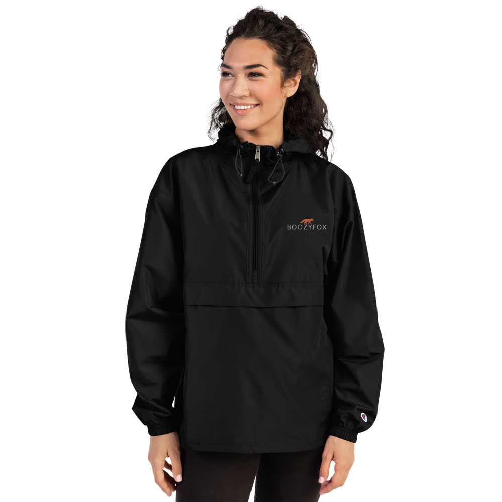 Smiling Woman Wearing a Black Champion Packable Jacket featuring a sleek embroidered Boozy Fox logo on the chest - Waterproof Champion Windbreakers & Raincoats - Boozy Fox