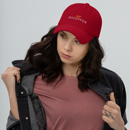 Woman Wearing a Cool Cranberry Red Dad Hat featuring an embroidered Boozy Fox logo on front. Shop Cool Dad Hats & Dad Caps Online - Boozy Fox
