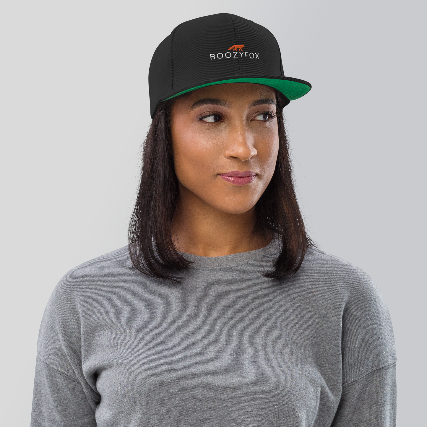 Woman Wearing a Black Snapback - Boozy Fox