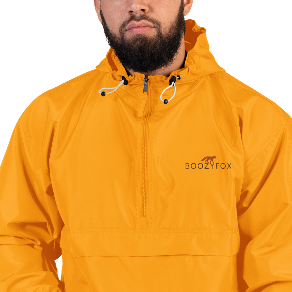 Man Wearing a Gold Champion Packable Jacket featuring a sleek embroidered Boozy Fox logo on the chest - Waterproof Champion Windbreakers & Raincoats - Boozy Fox