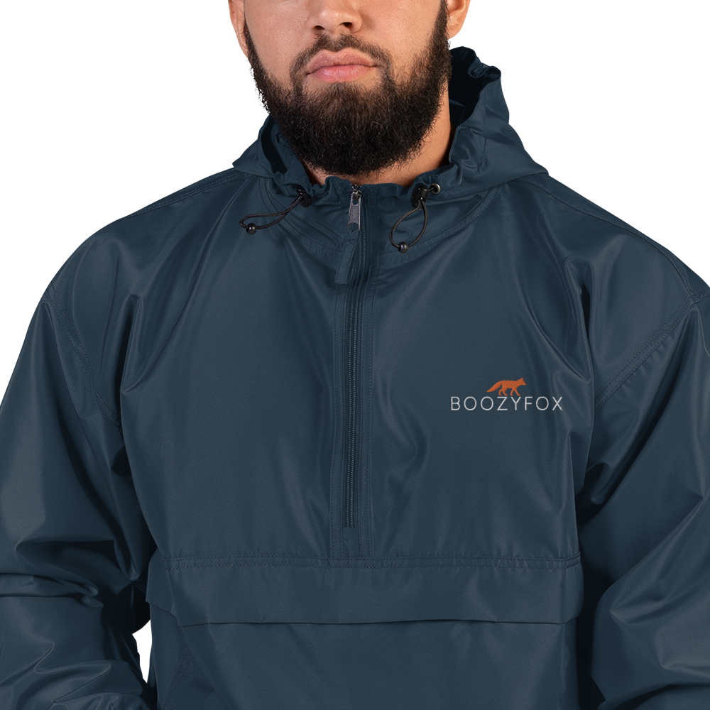 Man Wearing a Navy Champion Packable Jacket featuring a sleek embroidered Boozy Fox logo on the chest - Waterproof Champion Windbreakers & Raincoats - Boozy Fox