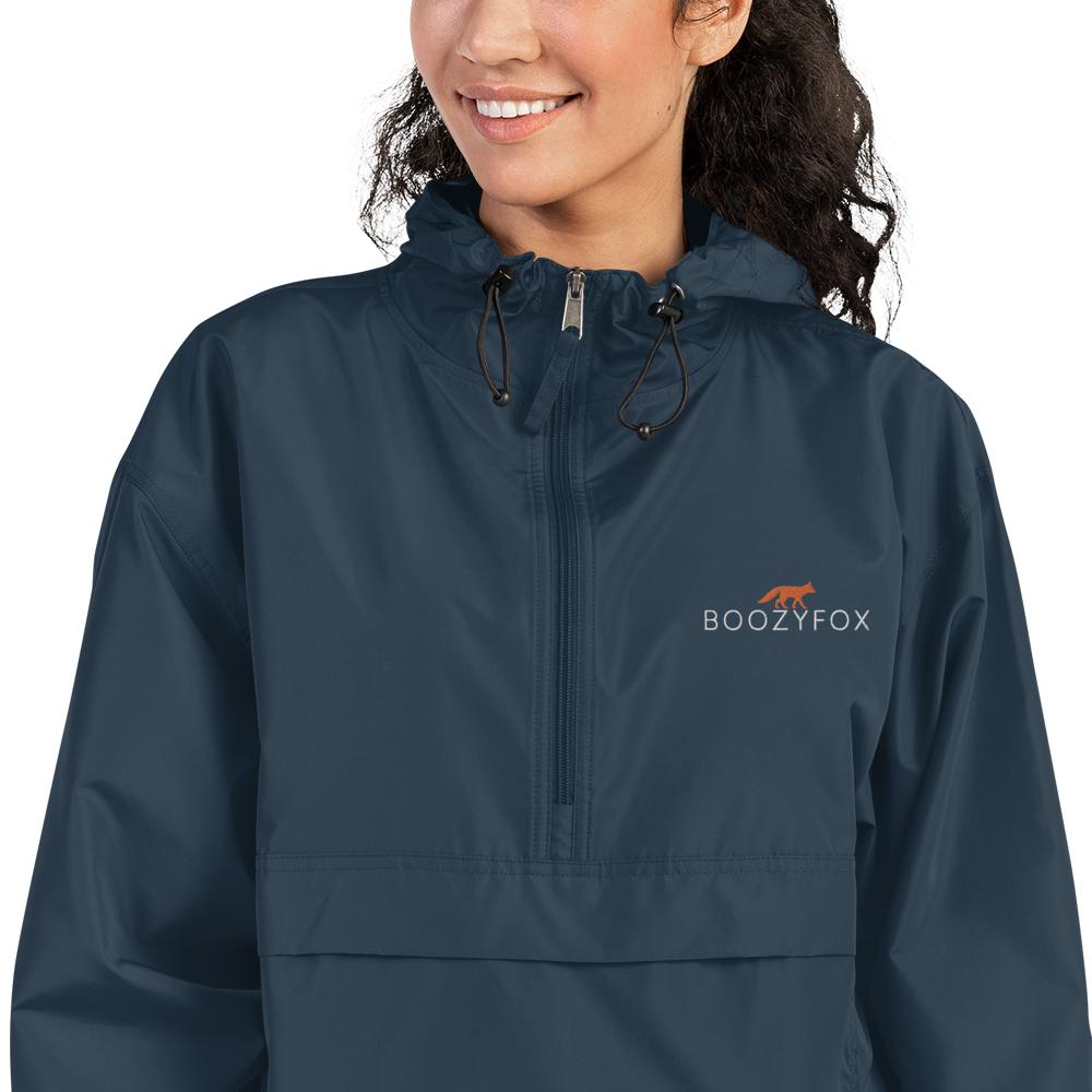 Smiling Woman Wearing a Navy Champion Packable Jacket featuring a sleek embroidered Boozy Fox logo on the chest - Waterproof Champion Windbreakers & Raincoats - Boozy Fox