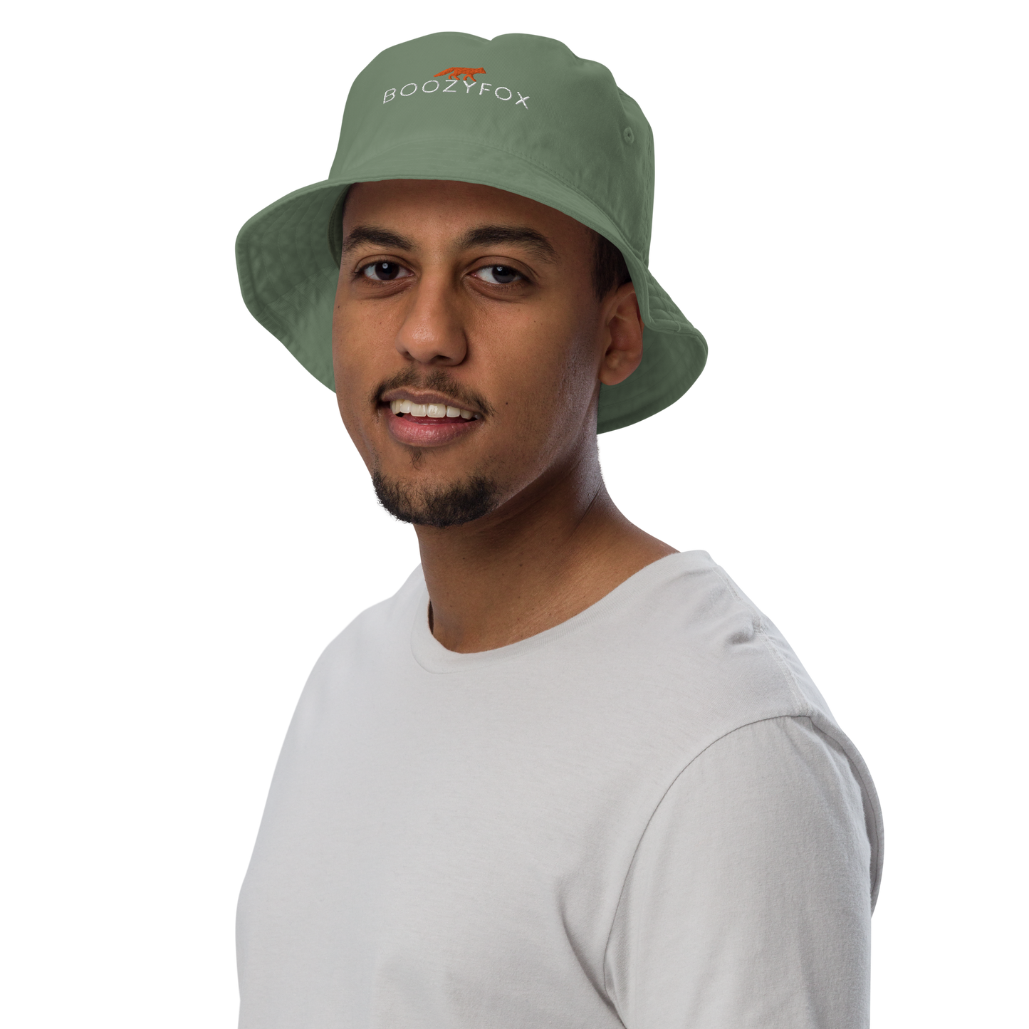 Man wearing a Dill Green Organic Bucket Hat featuring a recognizable Boozy Fox embroidery logo on the front - Bucket Hats - Boozy Fox