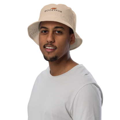 Man wearing a Stone Colored Organic Bucket Hat featuring a recognizable Boozy Fox embroidery logo on the front - Bucket Hats - Boozy Fox
