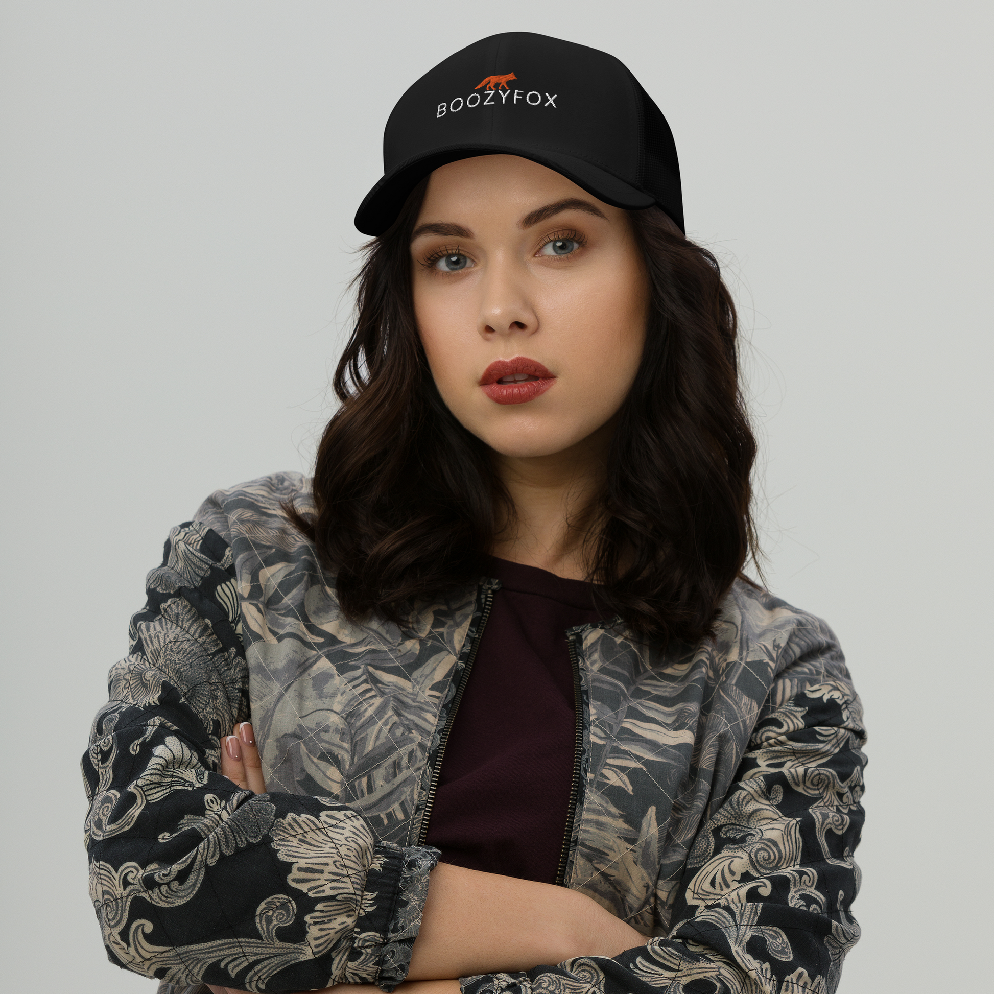 Woman Wearing Black Retro Trucker Hat featuring an embroidered Boozy Fox logo on front 